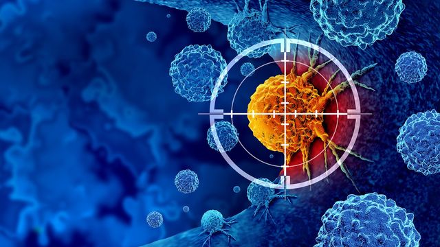 A cancer cell in orange surrounded by healthy cells in blue with a target on the cancer cell.