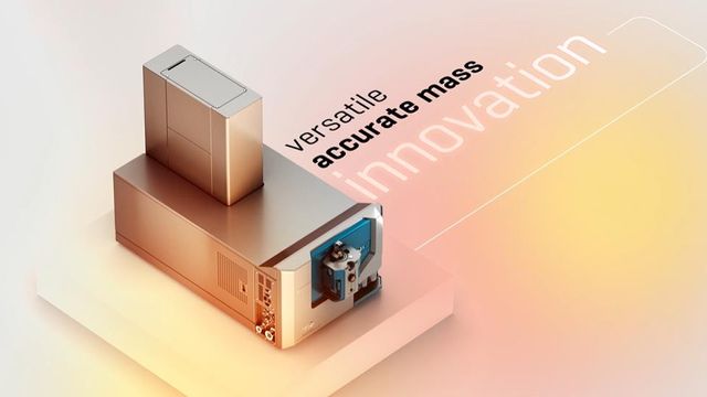 Modern mass spectrometer on a lit platform with the words “versatile,” “accurate mass,” and “innovation” in the background 